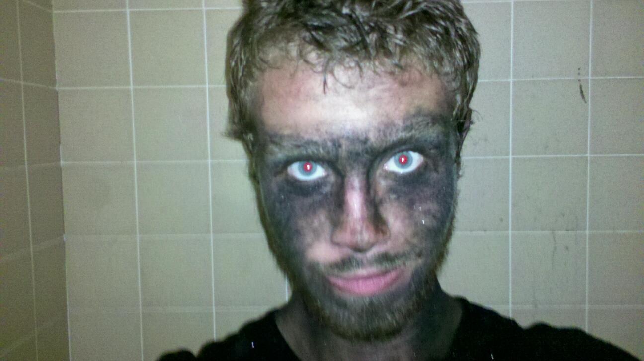 Rocky after a shift underground, face black with gilsonite dust